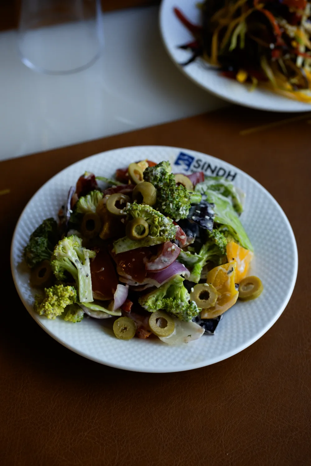 Broccoli and olive salad on a Sindh Resorts plate