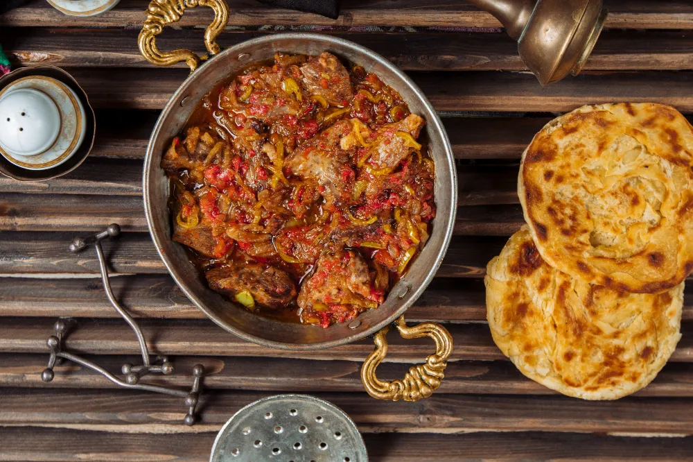 Kashmiri dishes served with fresh bread