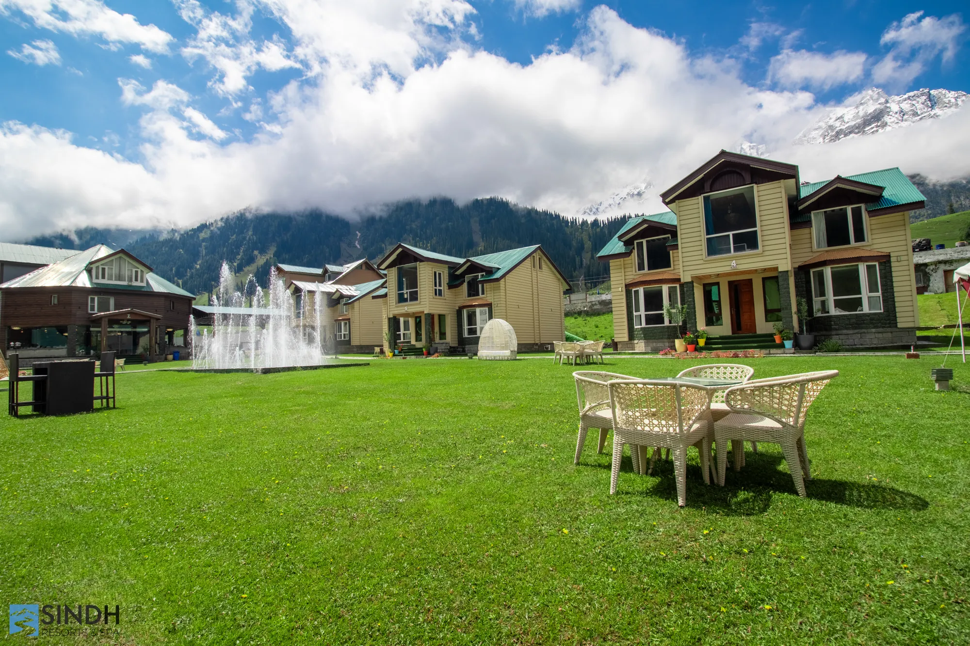 The resort lawn with cottages and the fountain, set for a celebration