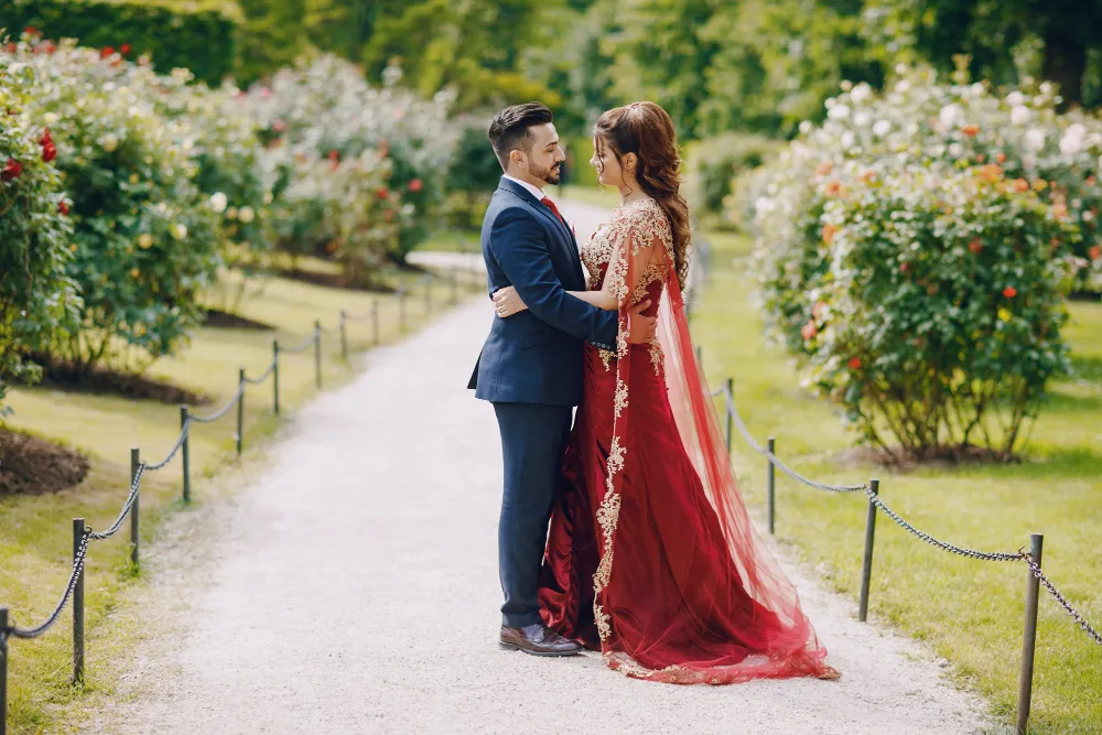 A couple embracing in a rose garden